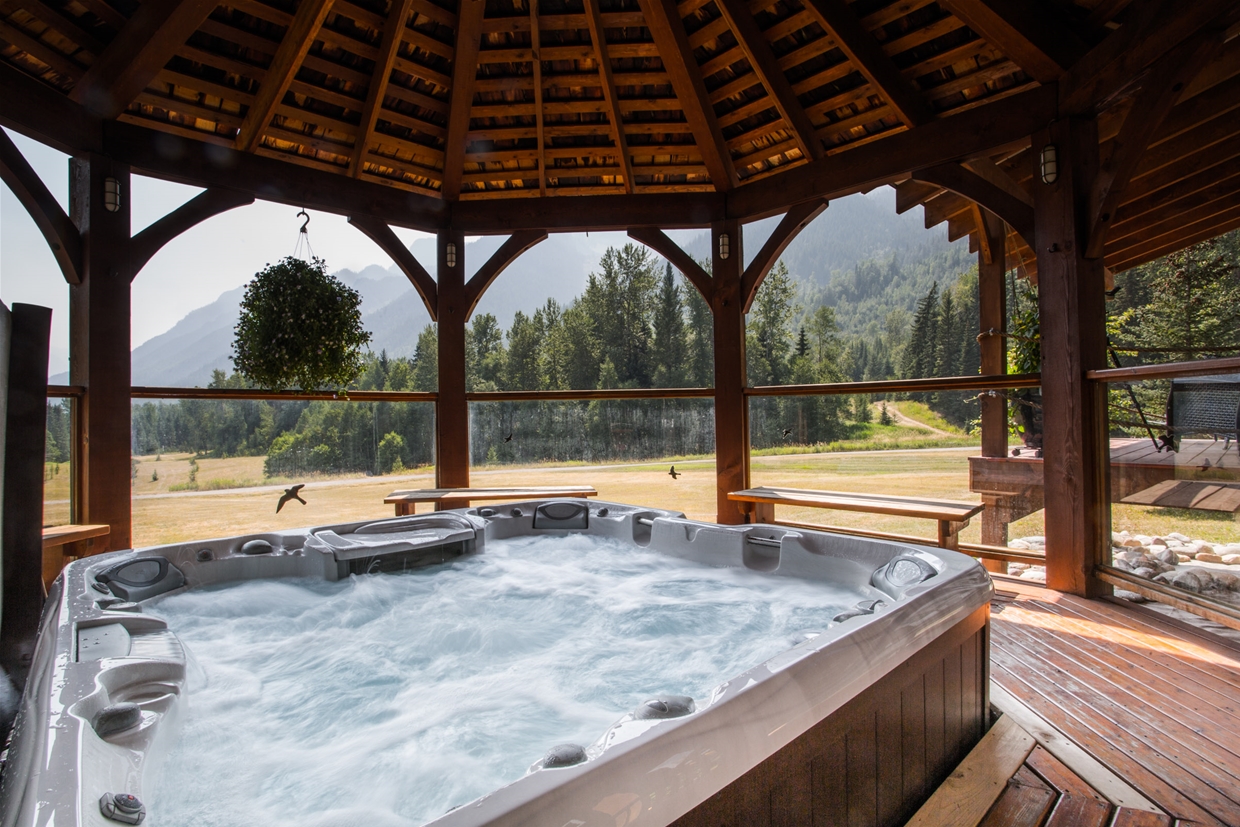 Relax in the hot tub with mountain views