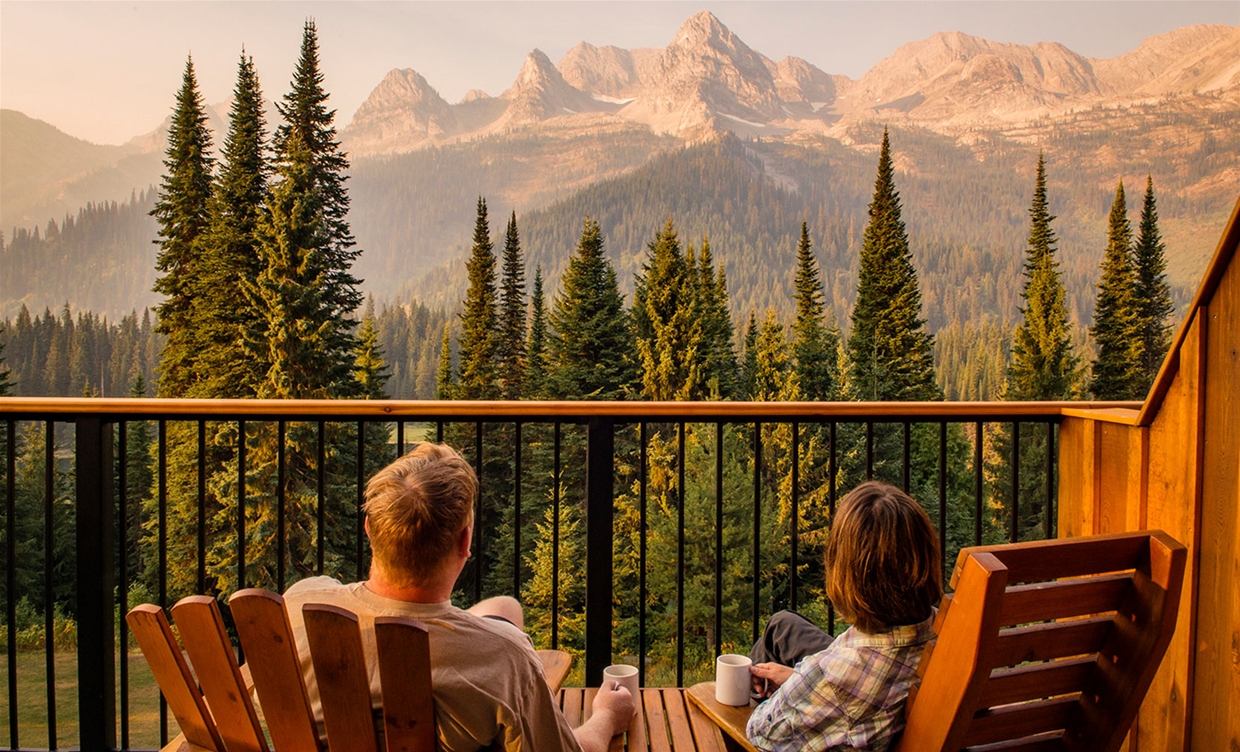 Couple enjoying views on their patio at Island Lake Lodge