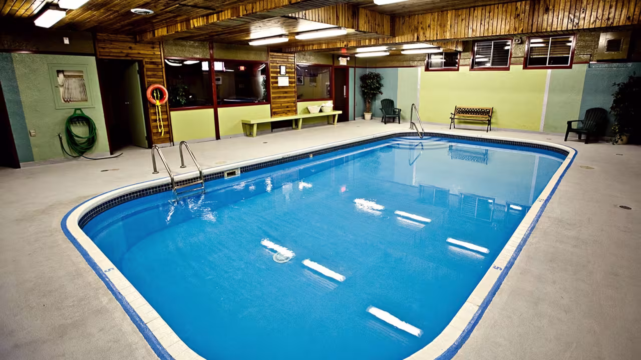 Indoor swimming pool with windows into the games room