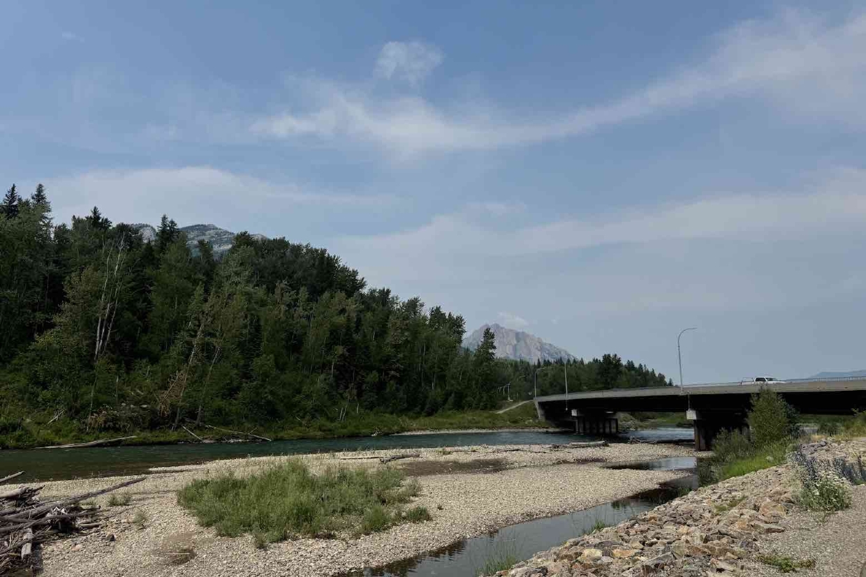 Looking north from the Elk River near the north Fernie bridge. 3pm, Thursday, July 18, 2024