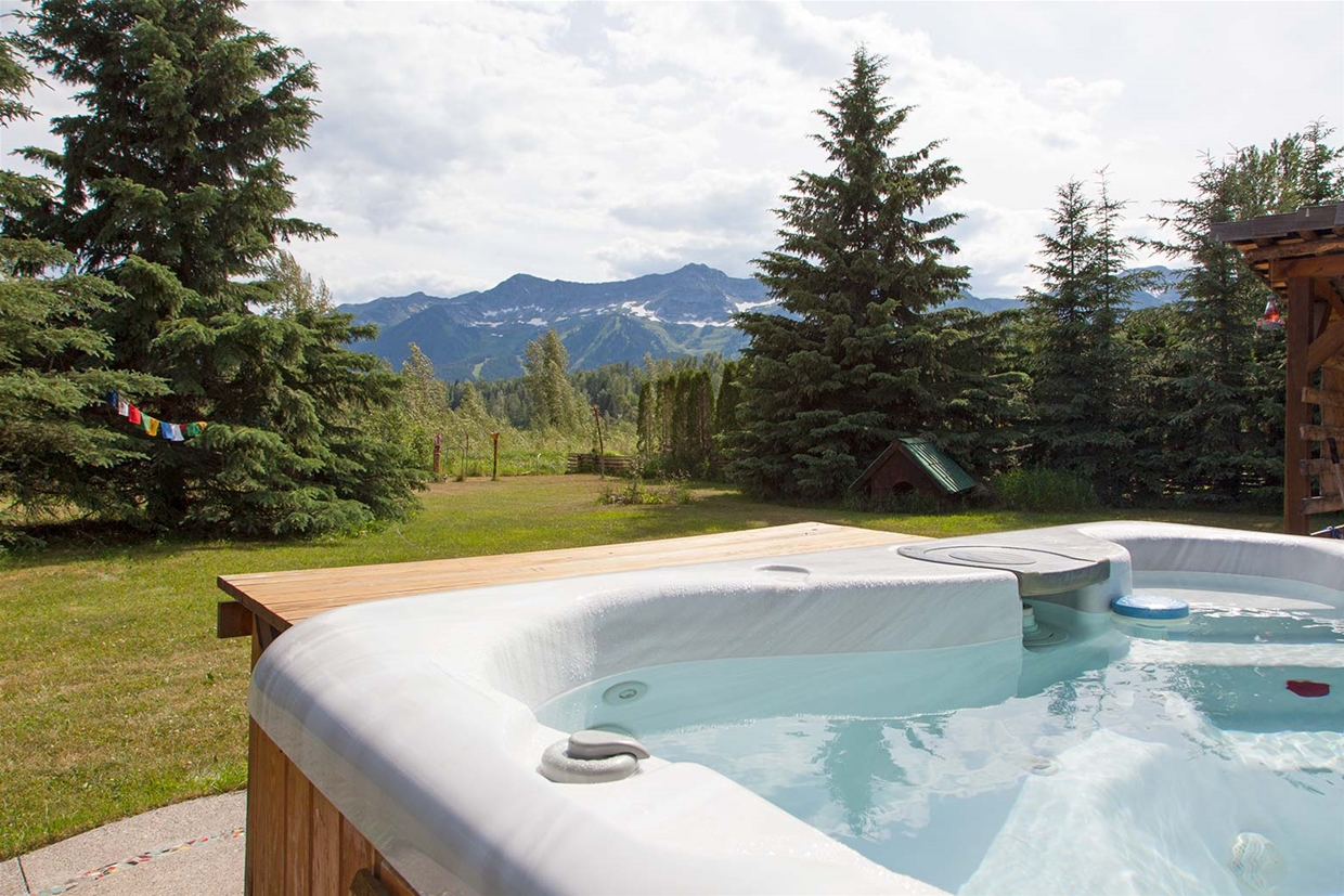 Hot tub with a view at Hideaway Lodge
