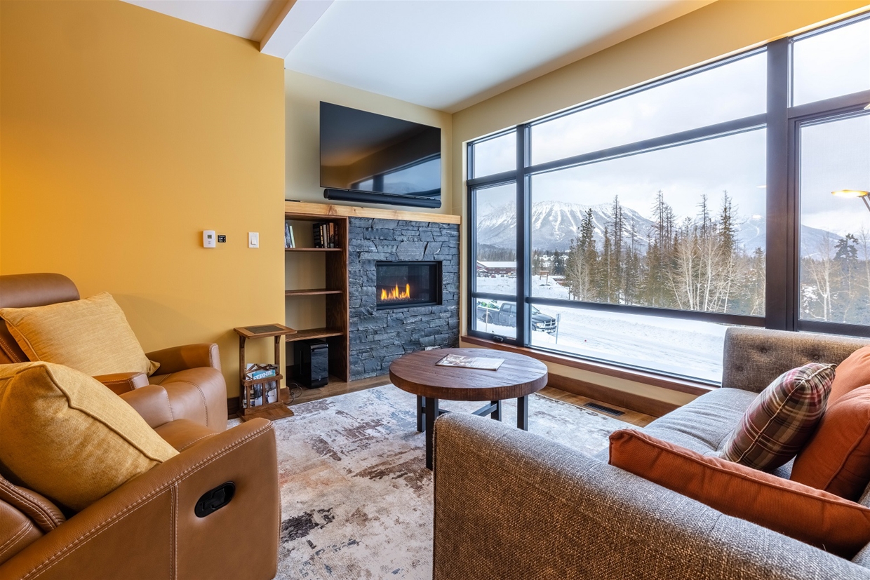 Relax in the den, complete with views and natural gas fireplace